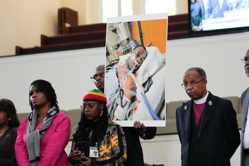 Family members and supporters hold a photograph of Tyre Nichols in hospital during a news conference in Memphis (Copyright 2023 The Associated Press. All rights reserved.)