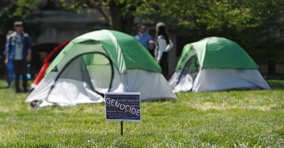 Protestors set up tents during the encampment protest, Thursday, April 25, 2024, at Purdue University College of Agriculture Administration Building Lawn in West Lafayette, Ind.