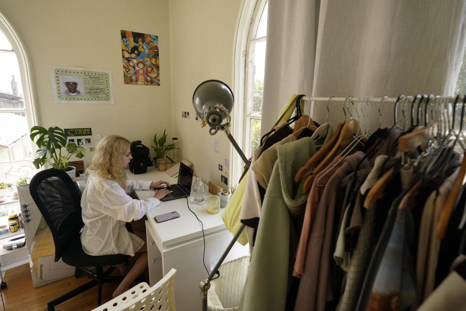 University of California, Berkeley junior Sofia Howard-Jimenez, studies at a desk in her converted dining room bedroom of the apartment she shares with three others in Berkeley, Calif., Tuesday, March 29, 2022. Millions of college students in the U.S. are trying to find an affordable place to live as rents surge nationally, affecting seniors, young families and students alike. (AP Photo/Eric Risberg)