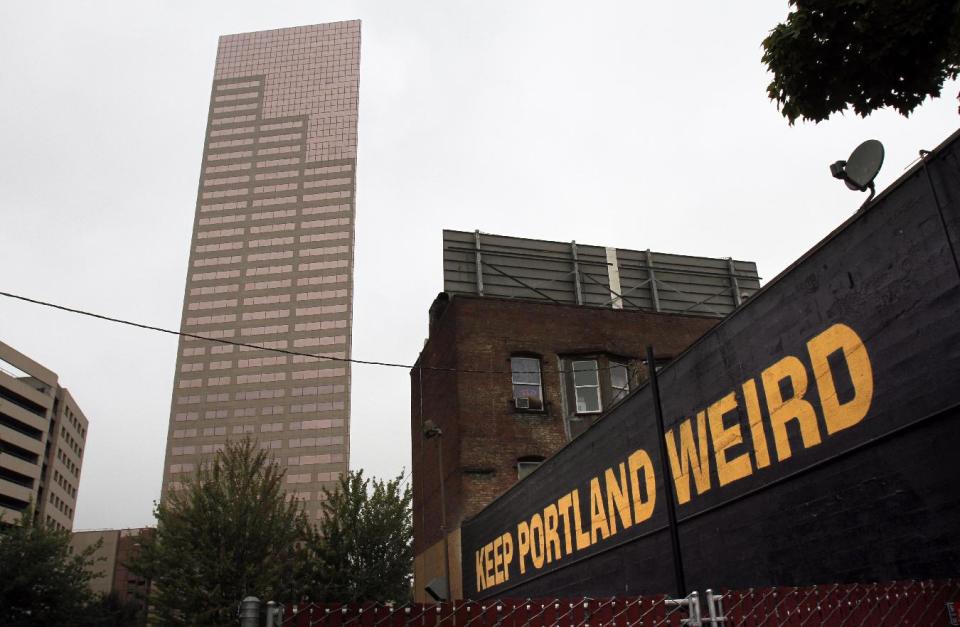 A downtown building sports a popular slogan in relation to the city in Portland, Ore., Wednesday, Sept. 19, 2012. Researchers at Portland State University found that the Portland atmosphere and culture is a magnet for the young and college educated, even though a disproportionate share of them are working in part-time jobs or positions that don’t require a college degree. (AP Photo/Don Ryan)