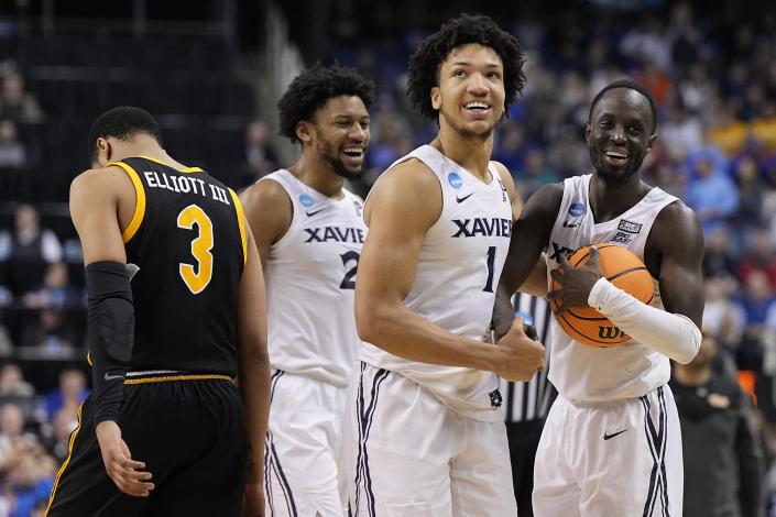 Xavier guard Desmond Claude and guard Souley Boum celebrate after their win against Pittsburgh in a second-round college basketball game in the NCAA Tournament on Sunday, March 19, 2023, in Greensboro, N.C. (AP Photo/Chris Carlson)