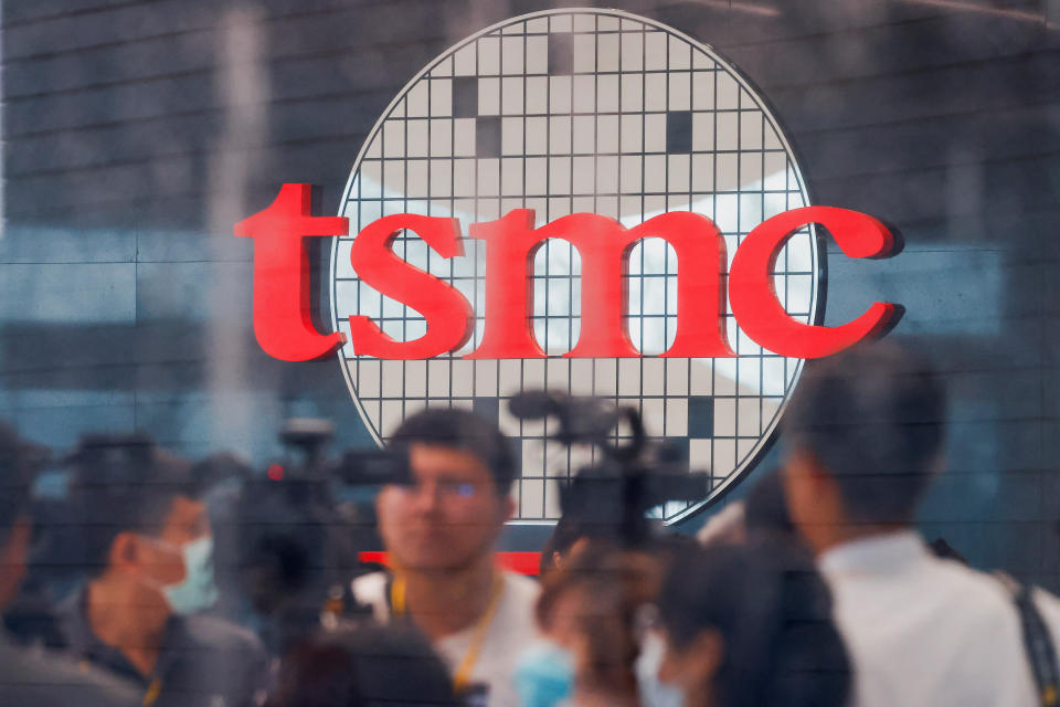 Taiwan Semiconductor Manufacturing Company's (TSMC) logo is seen while people attend the opening of the TSMC global R&D center in Hsinchu, Taiwan July 28, 2023. REUTERS/Ann Wang/File photo