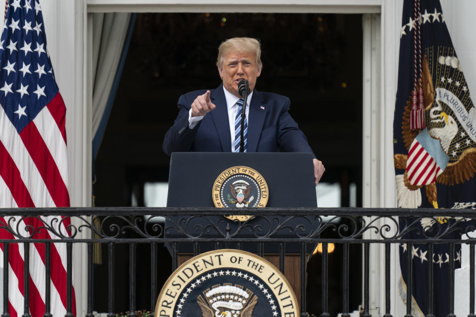 President Donald Trump speaks from the Blue Room Balcony of the White House to a crowd of supporters, Saturday, Oct. 10, 2020, in Washington. (AP Photo/Alex Brandon)