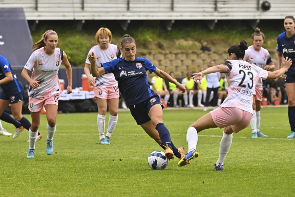 San Diego Wave FC forward Alex Morgan and Angel City FC forward Christen Press during a NWSL Challenge Cup match.