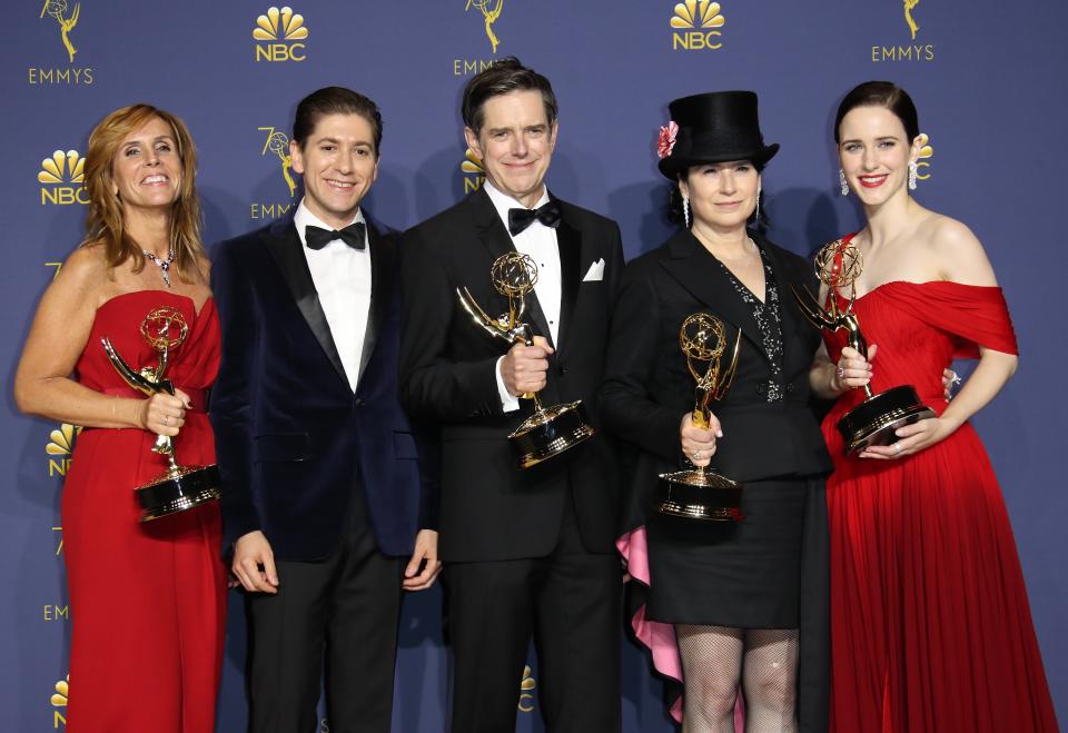 LOS ANGELES, CA - SEPTEMBER 17: (L-R) Dhana Gilbert, Michael Zegen, Daniel Palladino, Amy Sherman-Palladino and Rachel Brosnahan pose with their Outstanding Comedy Series awards for 'The Marvelous Mrs. Maisel' in the press room on September 17, 2018 in Los Angeles, California. (Photo by Dan MacMedan/Getty Images)