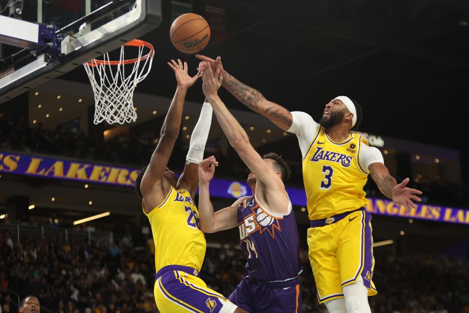 Los Angeles Lakers forward Anthony Davis (3) blocks a shot by Phoenix Suns forward Drew Eubanks (14) during the first quarter at Acrisure Arena in Palm Desert, Calif., on Oct. 19, 2023.