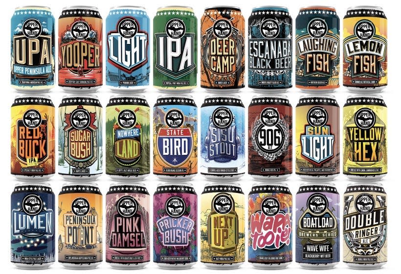 A view of 21 different cans designed for Upper Hand Brewing by Bells Brewery senior graphic designer Alex Smith.