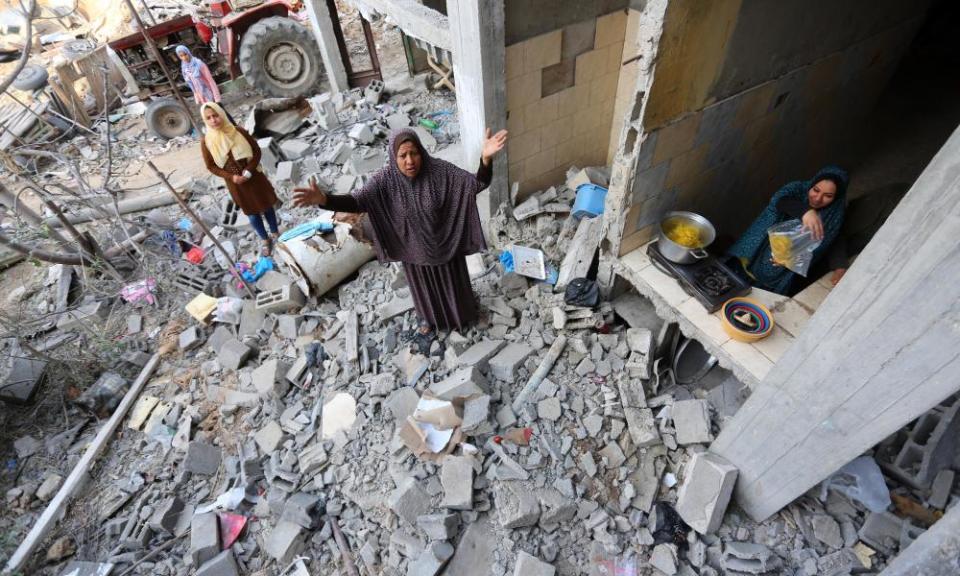 Palestinians return to their houses which were destroyed by the Israeli military, in Beit Hanoun, in the northern Gaza Strip, on Friday.