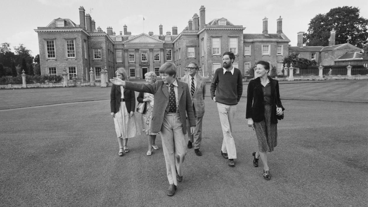  Charles Spencer in 1977, showing visitors around his home, Althorp. 
