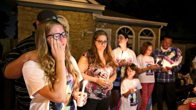 Payton Jordan, left, Kayla Storey’s best friend, gives a short speech during a candlelight ceremony in Riviera Beach in 2014 after Kayla, 17, was stabbed to death. (Richard Graulich / The Palm Beach Post)