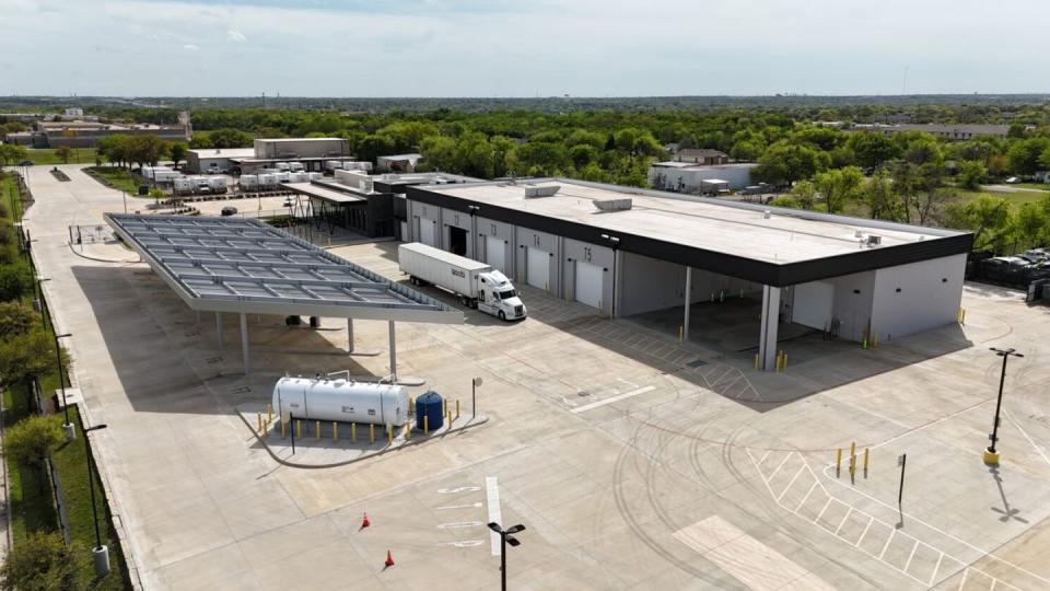 a large building with a parking lot