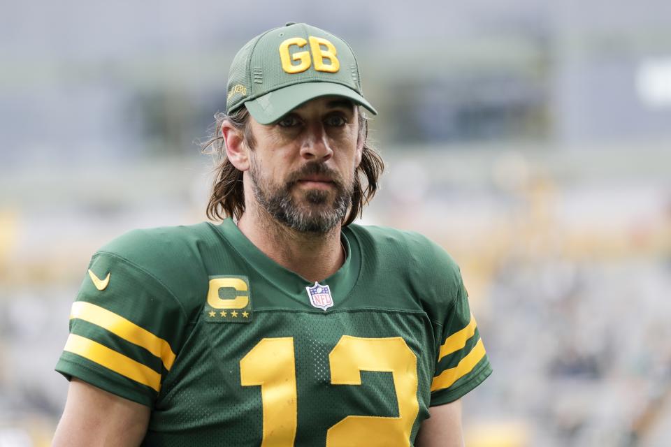 Green Bay Packers' Aaron Rodgers walks off the field after an NFL football game against the Washington Football Team Sunday, Oct. 24, 2021, in Green Bay, Wis. The Packers won 24-10. (AP Photo/Aaron Gash)