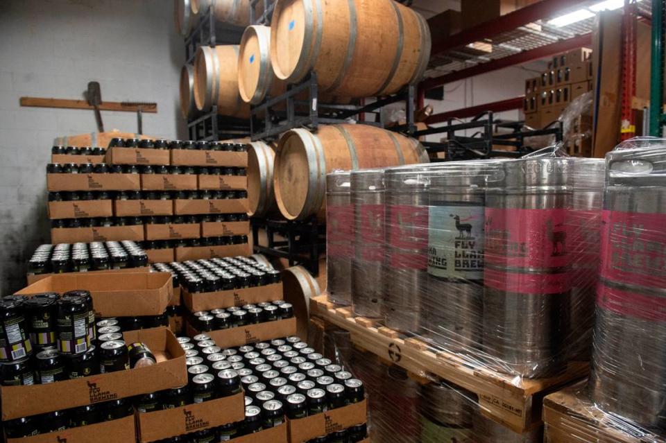 Cans, kegs and barrels of beer are in different stages of the brewing process at at Fly Llama Brewing in Biloxi.