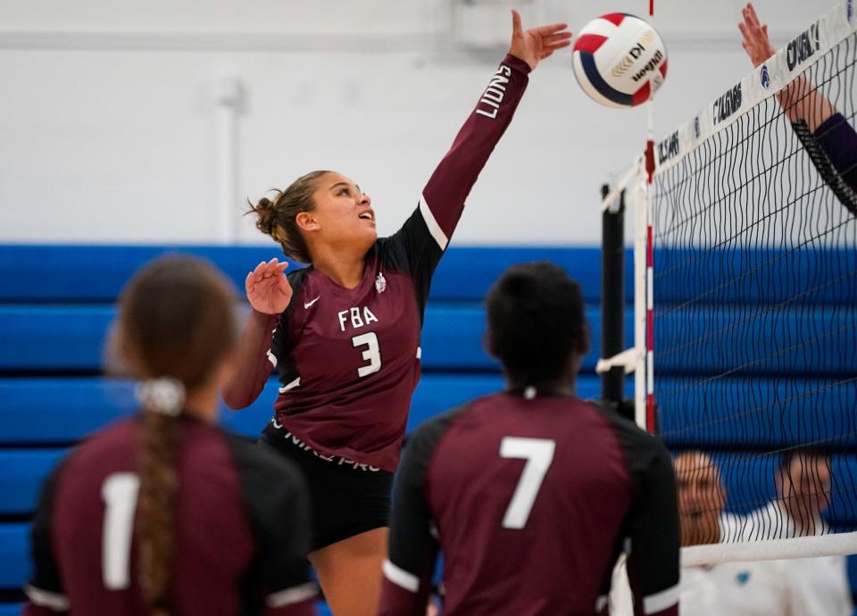 First Baptist Academy Lions hitter Zara Stewart (3) tips the ball against the Cypress Lake Panthers during a preseason jamboree at the Canterbury School in Fort Myers on Tuesday, Aug. 15, 2023.