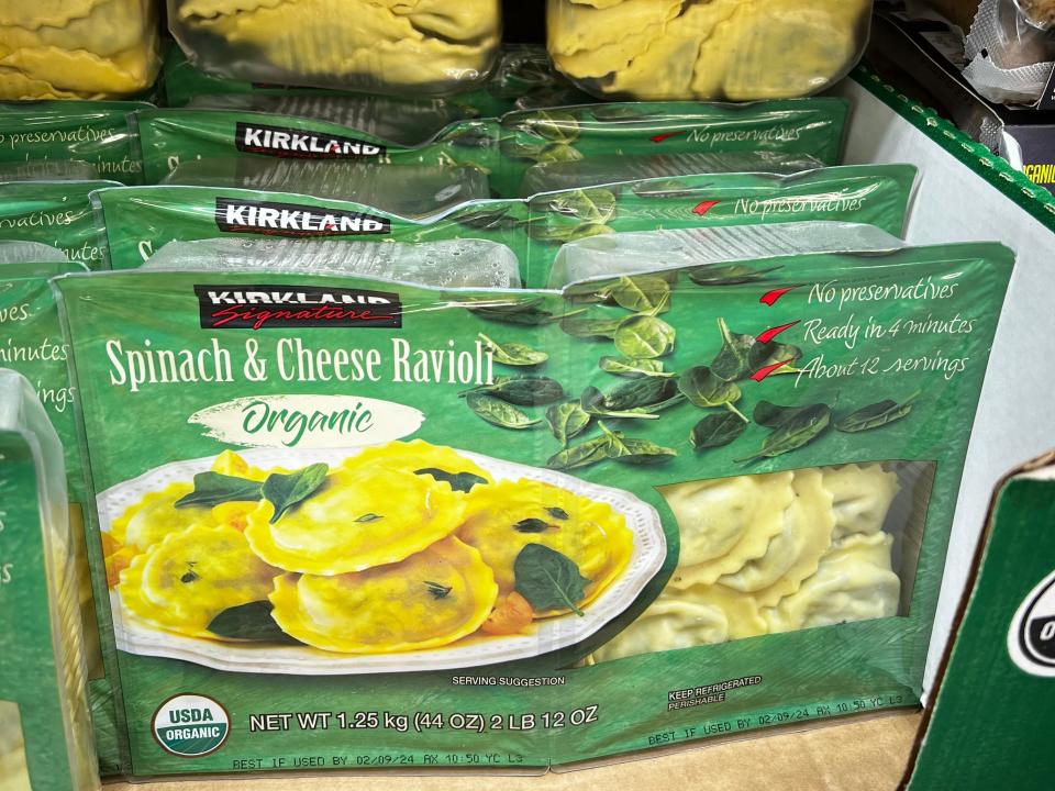 Packages of Kirkland Signature organic spinach-and-cheese ravioli on display at Costco.