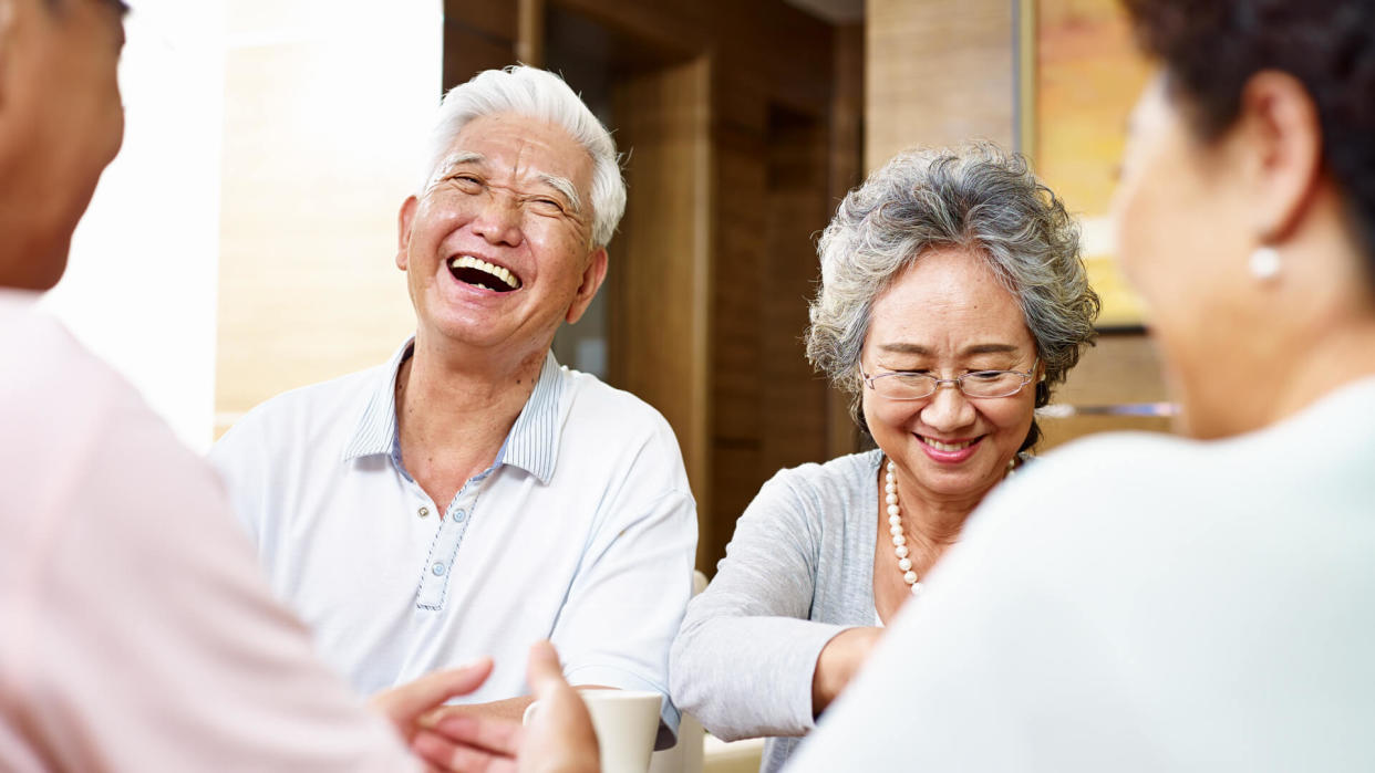 senior asian people getting together and having a good time.