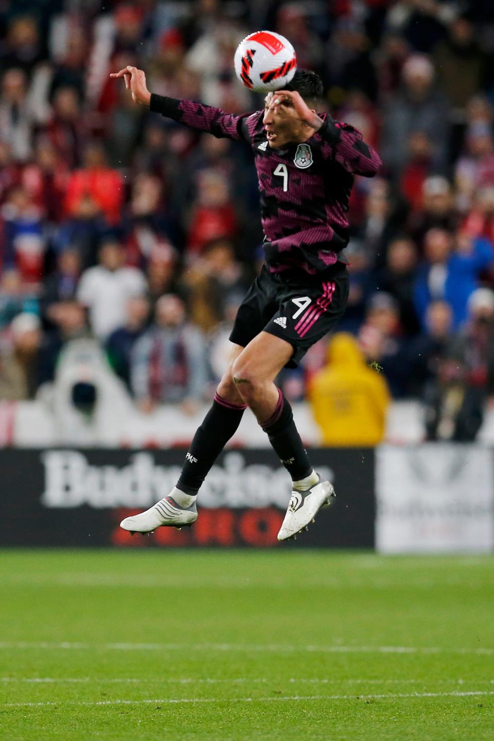 Edson Alvarez #4 of Mexico leaps for a header in the first half of a 2022 World Cup CONCACAF qualifying match between Mexico and USA at TQL Stadium in Cincinnati on Friday, Nov. 12, 2021. The score was tied 0-0 at halftime. 