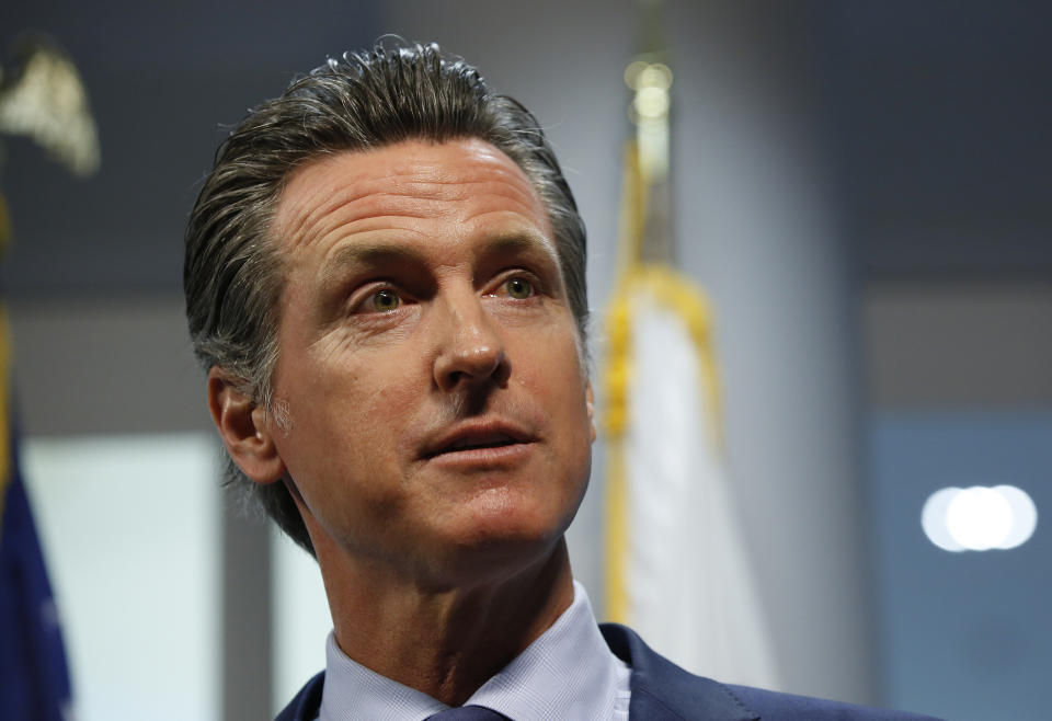 FILE - In this Friday, April 12, 2019, file photo, California Gov. Gavin Newsom answers a reporter's question about a report he presented concerning the worsening wildfires in the state, during a news conference, in Rancho Cordova, Calif. Newsom announced Friday, Dec. 13, that he has rejected a bankruptcy reorganization plan that Pacific Gas and Electric reached just last week with thousands of wildfire victims, including a $13.5 billion settlement. (AP Photo/Rich Pedroncelli, File)