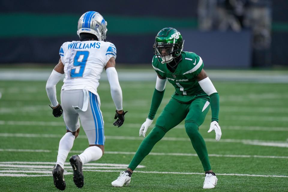 Jets cornerback Sauce Gardner (1) defends against  Lions wide receiver Jameson Williams during the third quarter Dec. 18, 2022, in East Rutherford, N.J.