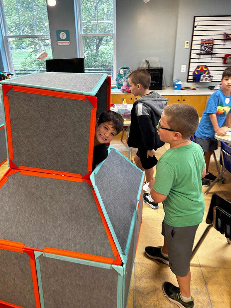 Children engage in an open-ended building activity at the Children’s Museum of New Hampshire.