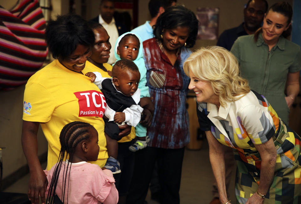 U.S. First Lady Jill Biden, right, reacts during a visit to a U.S. President's Emergency Plan for AIDS Relief (PEPFAR) project at an informal settlement near Windhoek, Namibia, Thursday, Feb. 23, 2023. The First Lady is on a five-day visit to Africa as part of President Biden's commitment to deepen engagement with African nations. (AP Photo/Dirk Heinrich)