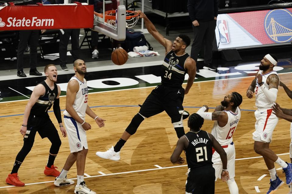 Milwaukee Bucks' Giannis Antetokounmpo dunks during the second half of an NBA basketball game against the LA Clippers Sunday, Feb. 28, 2021, in Milwaukee. The Bucks won 105-100. (AP Photo/Morry Gash)