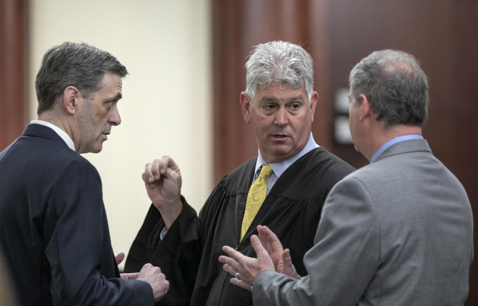 State Judge Eugene Griffith, center, confers with 11th Circuit Solicitor Rick Hubbard, left, and defense attorney Boyd Young during the sentencing phase of the trial of Tim Jones in Lexington. Timothy Jones, Jr. has been found guilty of killing his 5 young children in 2014. (Tracy Glantz/The State via AP, Pool)