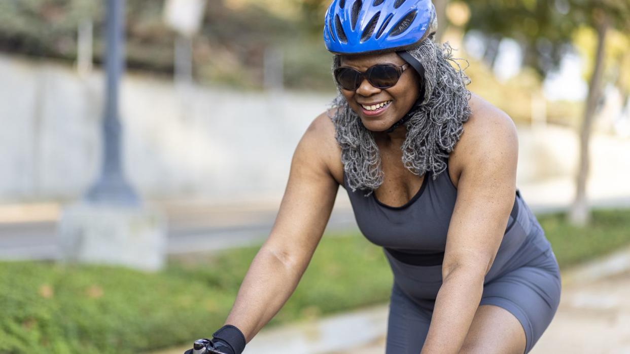 senior black woman riding bicycle