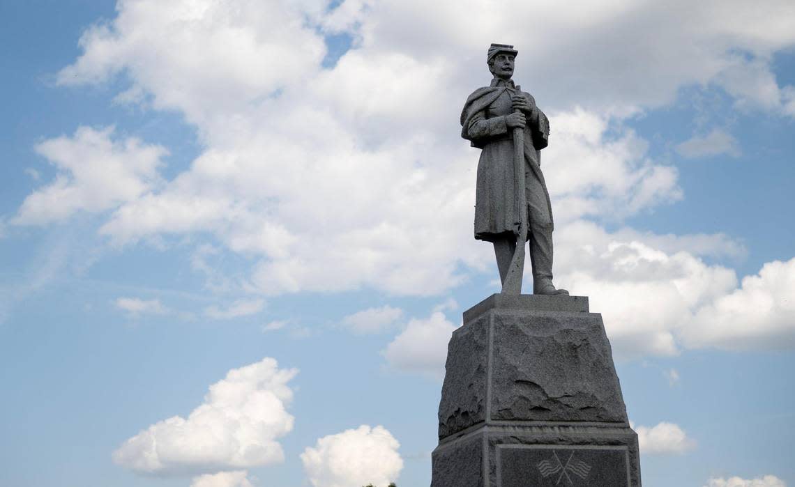 This memorial features a statue of a Civil War-era soldier.
