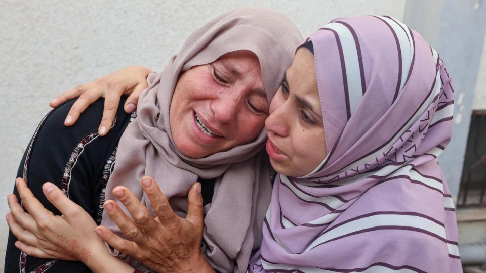 PHOTO: Palestinians mourn over the bodies of relatives killed in Israeli bombardment, at the al-Najar hospital in Rafah, in the southern Gaza Strip, Apr. 21, 2024. (Mohammed Abed/AFP via Getty Images)