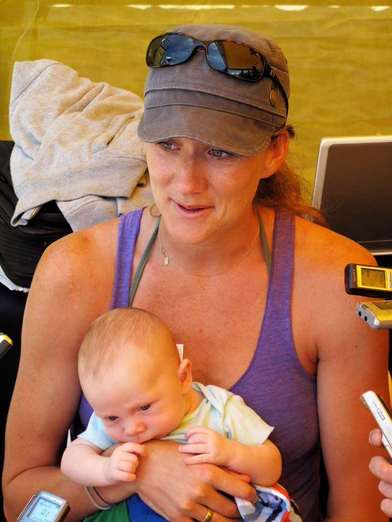 AVP player Kerri Walsh holds Joseph, son of Walsh and AVP player Casey Jennings, as she is interviewed at the AVP Crocs Manhattan Beach Open on July 18, 2009 in Manhattan Beach, California.