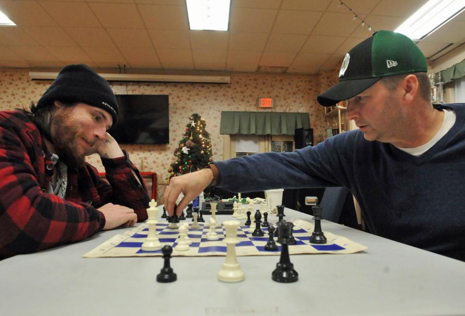 Stan O'Harte, of Quincy, left, watches Doug Southall, of Hanson, move his pawn during the first night of the Quincy Chess Club at Bethany Congregational Church in Quincy on Wednesday, Jan. 3, 2024.