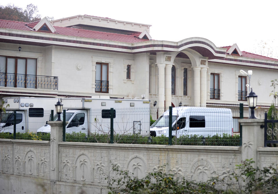 Turkish police cars seen parked as they search two adjoining villas in Yalova in northwest Turkey, Monday, Nov. 26, 2018. Police, aided by sniffer dogs, continue an investigation into the killing of Saudi journalist Jamal Khashoggi, officials and news reports said. Crime scene investigators and other officials sealed off a villa near the town of Termal in Yalova province and later expanded their search to the grounds of a neighboring villa, the state-run Anadolu agency reported. The walls surrounding a private villa bears a similar symbol to the ones on the Saudi consulate entrance in Istanbul.(DHA via AP)