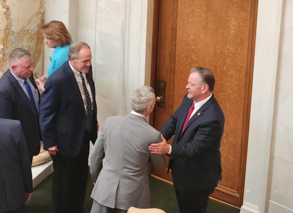  House Speaker Designate Brian Evans (right), R-Cabot, accepts congratulations from his fellow Republican Reps. (from left) Marcus Richmond of Harvey, Les Warren of Hot Springs and John Maddox of Mena on the House floor Thursday, May 9, 2024. (Tess Vrbin/Arkansas Advocate)