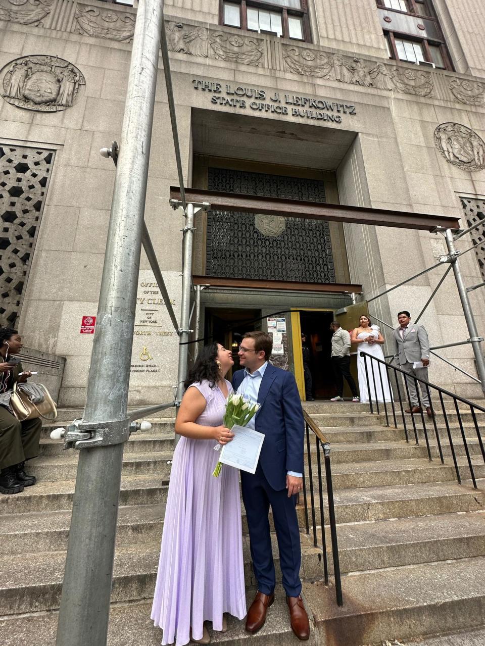 Chandler Dean and Carolina Treviño celebrate after their courthouse wedding.