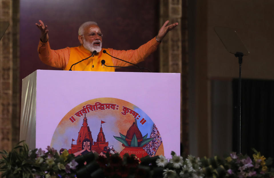In this Sunday, Feb. 24, 2019 photo, Indian Prime Minister Narendra Modi, speaks after taking a holy dip at Sangam, the confluence of the Rivers Ganges, Yamuna and mythical Saraswati, during Kumbh festival, in Allahabad, India. India's Election Commission has announced that the upcoming national election will be held in seven phases in April and May as Prime Minister Narendra Modi's Hindu nationalist party seeks a second term. (AP Photo/ Rajesh Kumar Singh)