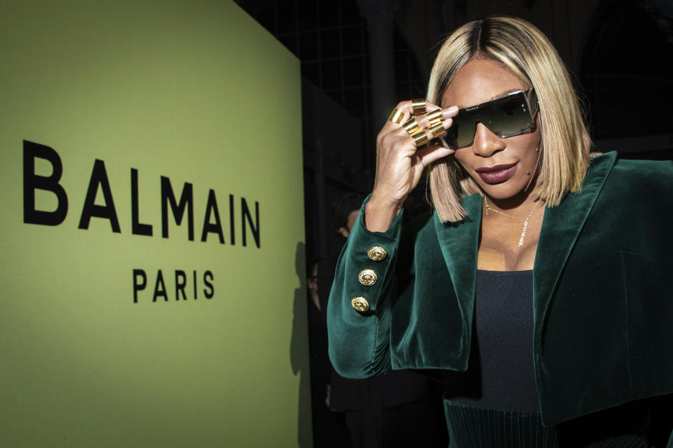 FILE - Serena Williams attends the Balmain Ready To Wear Fall/Winter 2022-2023 fashion collection, unveiled during the Fashion Week in Paris, Wednesday, March 2, 2022. After nearly three decades in the public eye, few can match Serena Williams' array of accomplishments, medals and awards. Through it all, the 23-time Grand Slam title winner hasn't let the public forget that she's a Black American woman who embraces her responsibility as a beacon for her people. (Photo by Vianney Le Caer/Invision/AP, File)