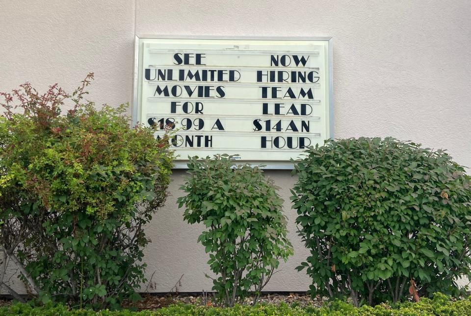 A sign still sits outside the Great Escape Regal Theater in Bedford. Today, July 20, is its last day.