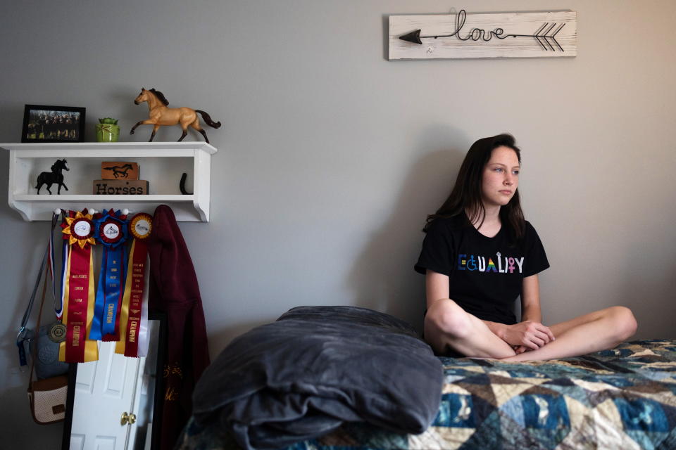 Sara Lundberg, who struggled with mental health issues like anxiety and depression during the pandemic, poses for a portrait in her bedroom in Schnecksville, Pennsylvania, April 28, 2021. REUTERS/Hannah Beier