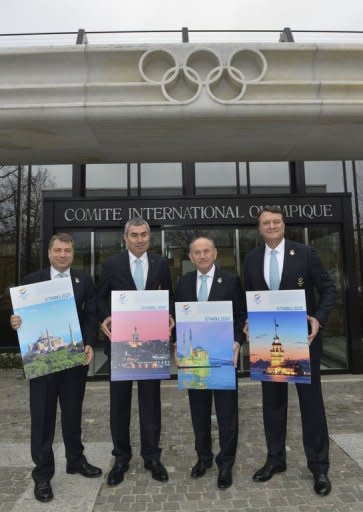 Members of the delegation of Istanbul (L to R) Ali Kiremitcioglu, CEO, IOC member and NOC President, Prof. Ugur Erdener, Major of Istanbul, Kadir Topbas and Bid Committee Leader, Hasan Arat, pose with the candidature files prior to the hand over on January 7, 2013 at the headquarters of the International Olympic Committee in Lausanne