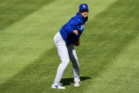 Los Angeles Dodgers' Shohei Ohtani reacts as he throws before a baseball game against the Washington Nationals at Nationals Park, Tuesday, April 23, 2024, in Washington. (AP Photo/Alex Brandon)