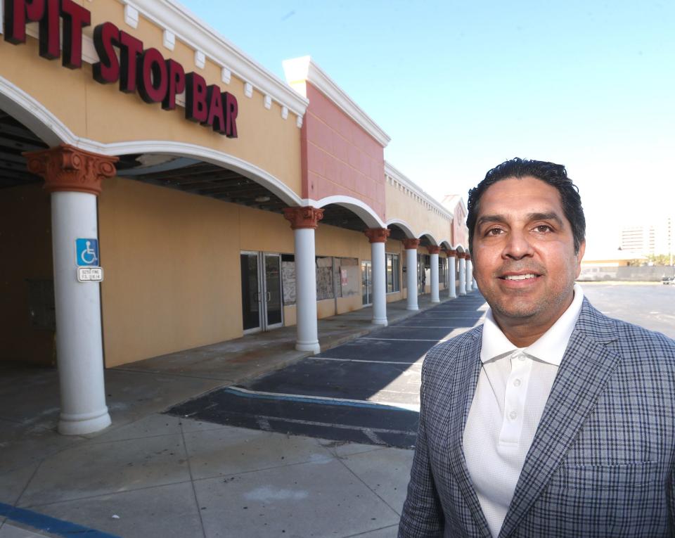 Jai Motwani, owner of the side-by-side Emerald Shores and SeaScape Inn in Daytona Beach Shores, stands in front of the storm-damaged Pappas Plaza in Daytona Beach Shores. After investing $3 million in repairs of the two hotels, Motwani's company, South Florida-based Hotel Motel Inc., recently bought the beachside shopping plaza with plans to renovate and reopen it.