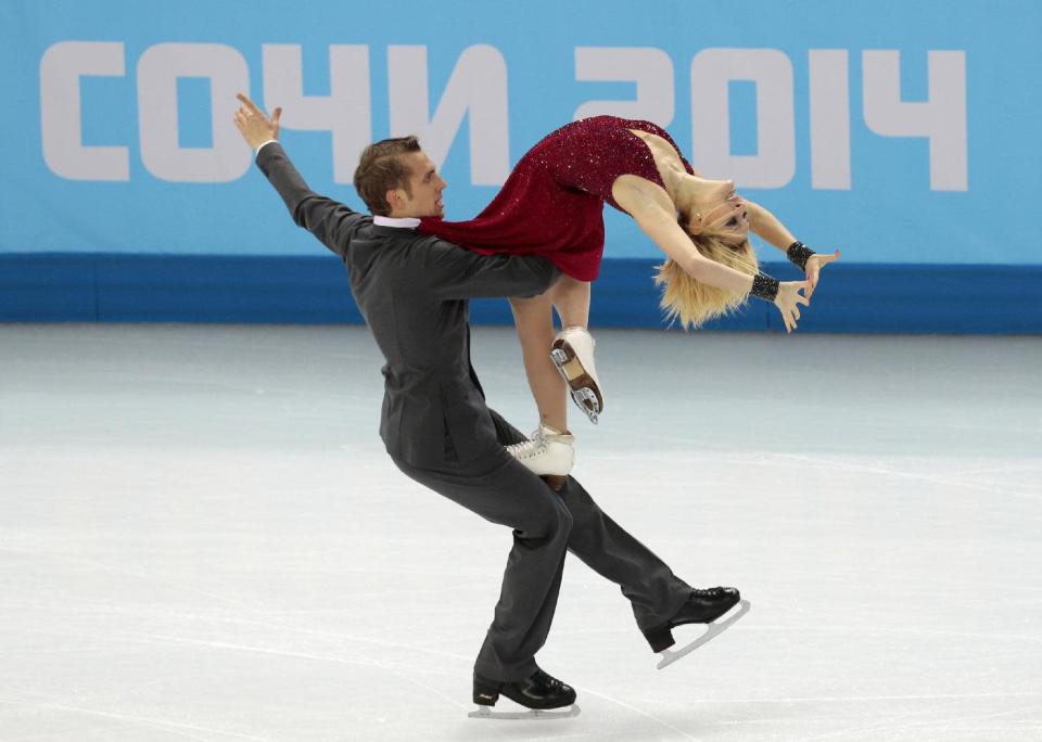Isabella Tobias and Deividas Stagniunas of Lithuania compete in the ice dance free dance figure skating finals at the Iceberg Skating Palace during the 2014 Winter Olympics, Monday, Feb. 17, 2014, in Sochi, Russia. (AP Photo/Ivan Sekretarev)