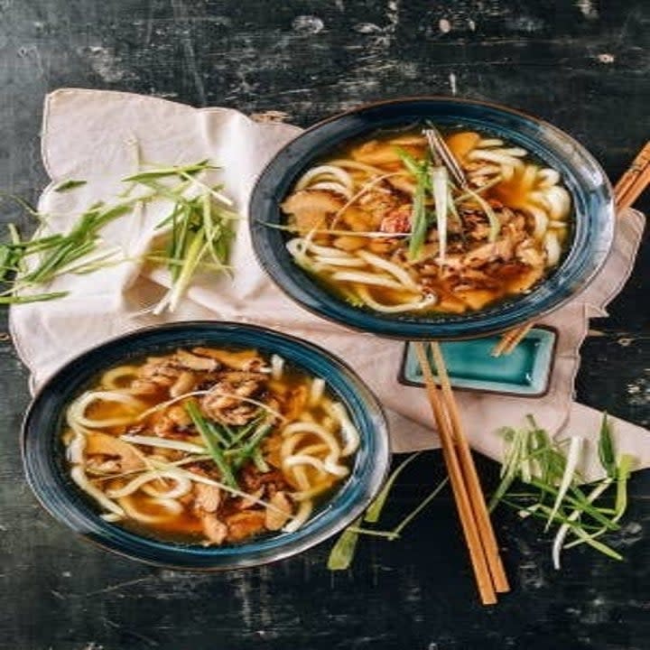 Udon Noodle Soup With Chicken and Mushrooms in bowls