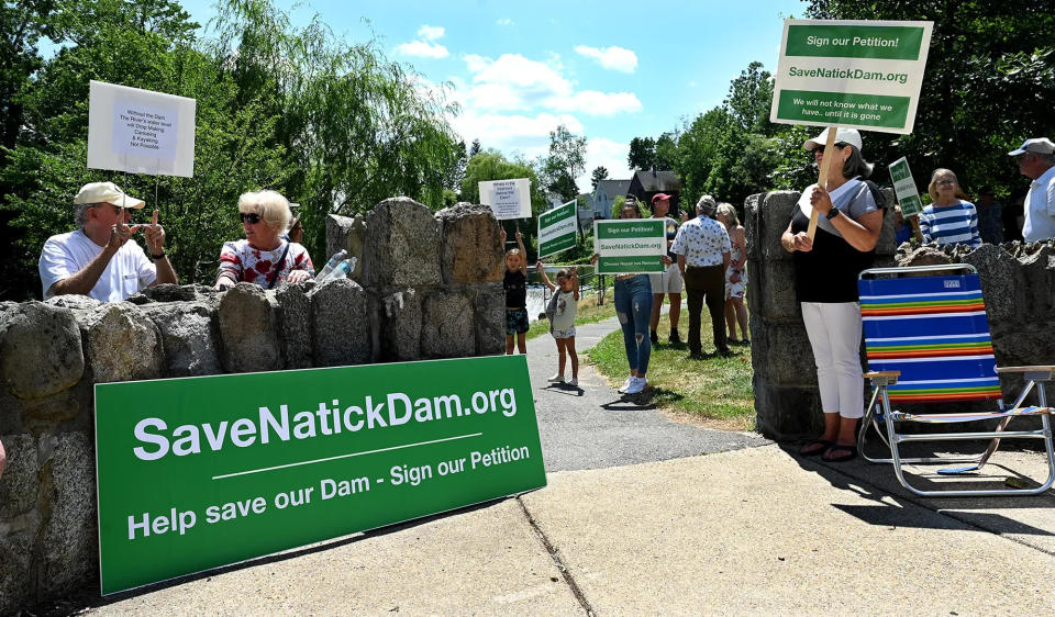 Natick residents and others in favor of repairing the Charles River Dam in South Natick rallied last summer at the site of the dam.