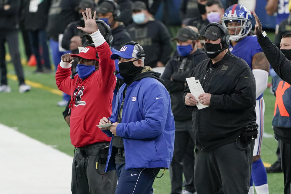 New York Giants head coach Joe Judge, center, watches his team during the second half of an NFL football game against the Philadelphia Eagles, Sunday, Nov. 15, 2020, in East Rutherford, N.J. (AP Photo/Seth Wenig)