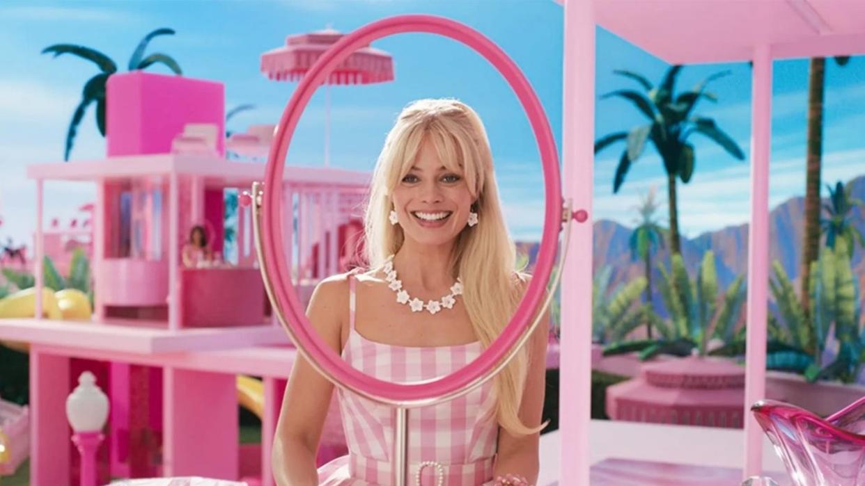 Margot Robbie plays Barbie in pink gingham dress