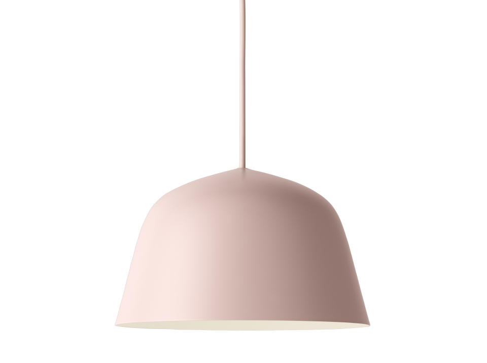 This photo courtesy of Knoll shows a soft rosy-peach tone pendant light in the Knoll + Muuto Work From Home Collection. This aluminum Muuto Ambit pendant light with a matte-finish is a fresh addition to any space, not just a home office. Ice cream is one of summer's pleasures. So why not lift moods and have a little decor fun this season by bringing some ice-creamy colors into your living space? Interior design experts say you can get that summery vibe with a few accessories or a can of paint or roll of wallpaper. (Courtesy of Knoll via AP)