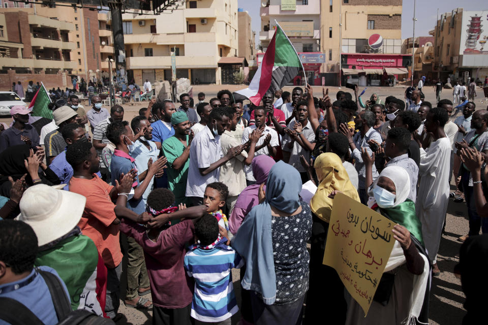 People chant slogans during a protest in Khartoum, Sudan, Saturday, Oct. 30, 2021. Pro-democracy groups called for mass protest marches across the country Saturday to press demands for re-instating a deposed transitional government and releasing senior political figures from detention. (AP Photo/Marwan Ali)