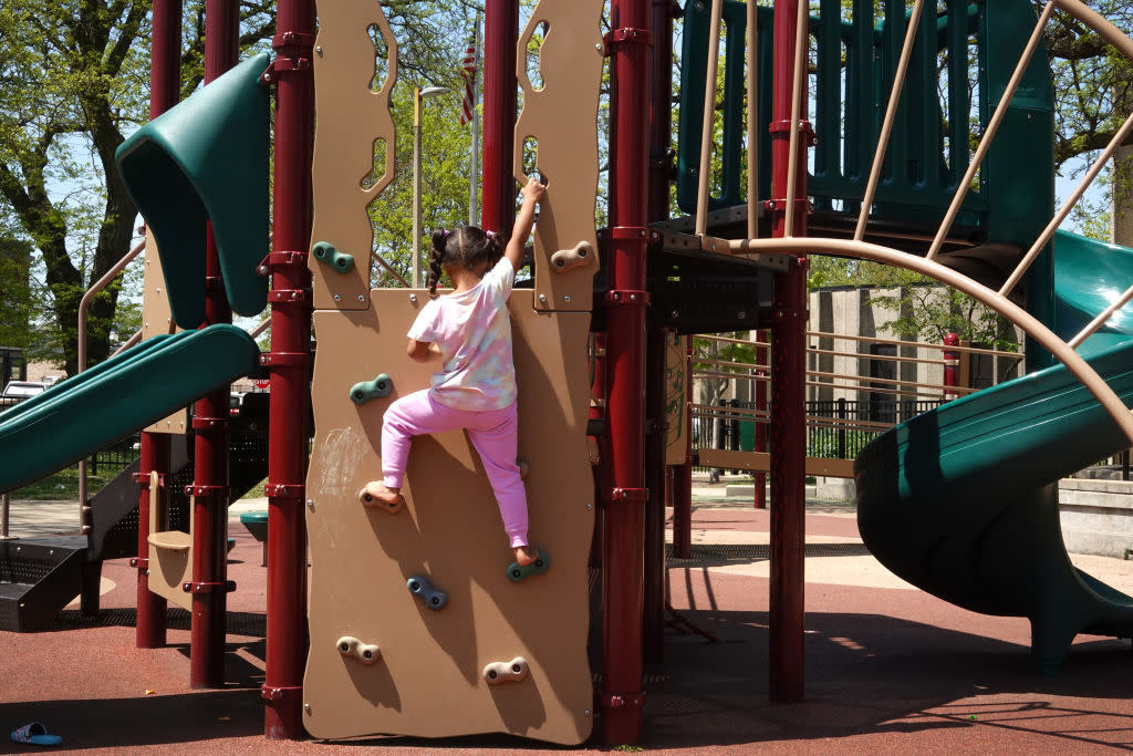 A child plays on a playground.